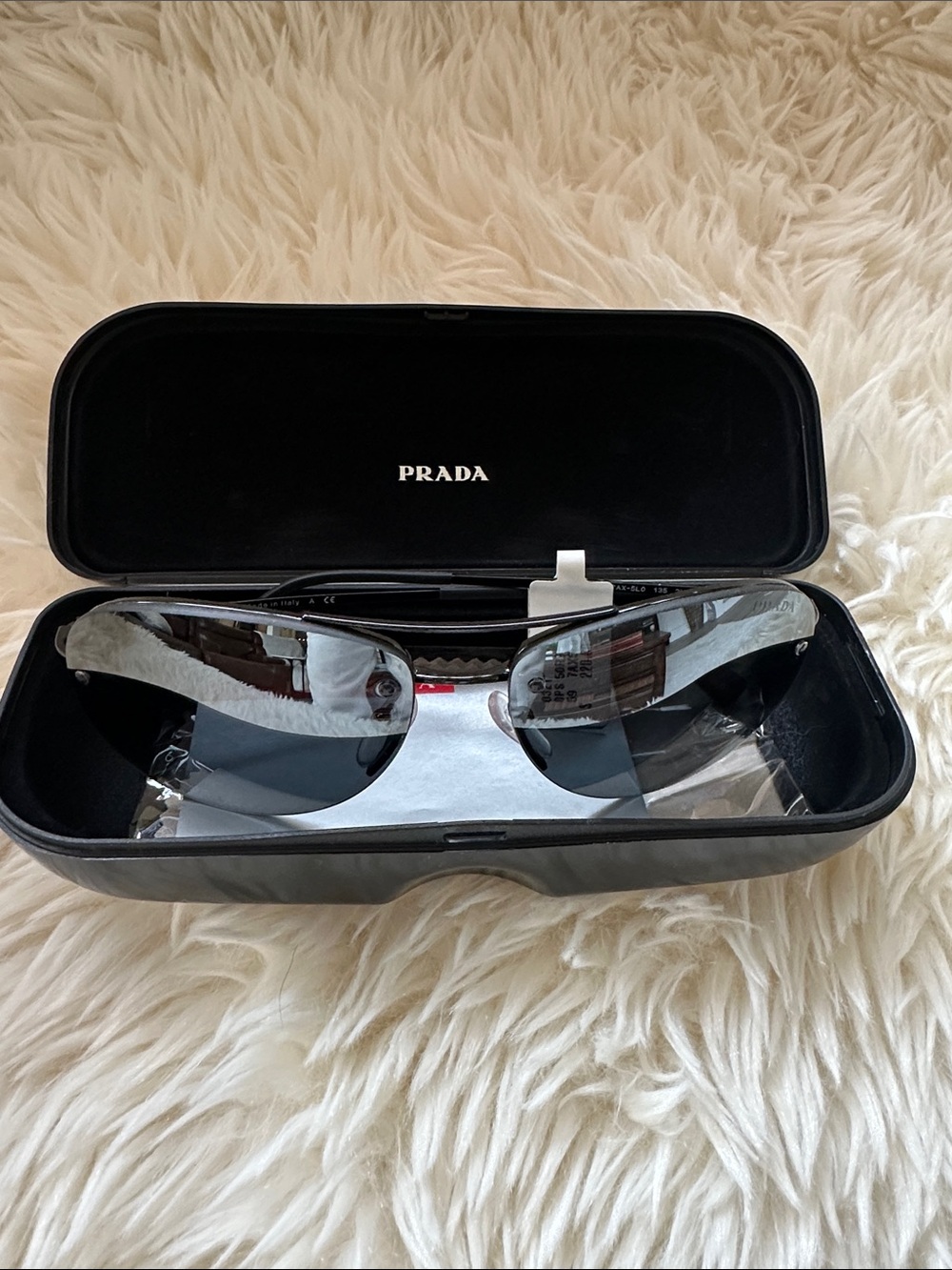 Prada Men’s Black and Silver Rimless Sunglasses